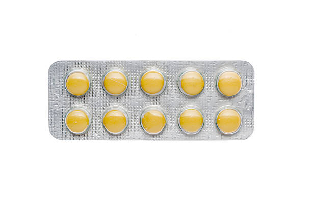 黄色の薬には火膨れ - pill medicine capsule excess ストックフォトと画像
