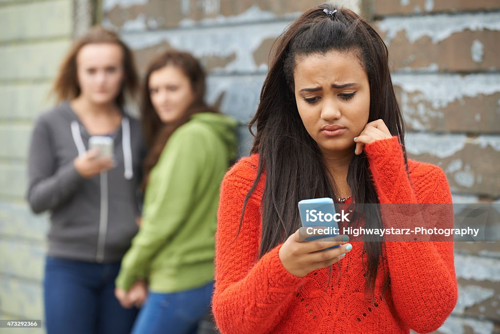 Teenage Girl Being Bullied By Text Message Cyberbullying Stock Photo
