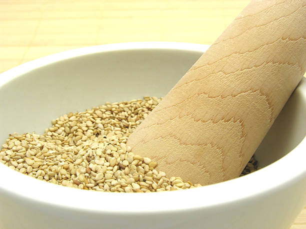 istock Sesame in a bowl of china ware with pestle 473292640