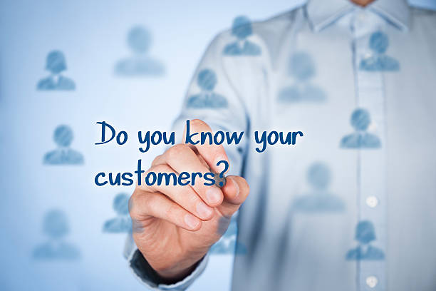 istock Man writing Do you know your customers? on a clear wall 473293076