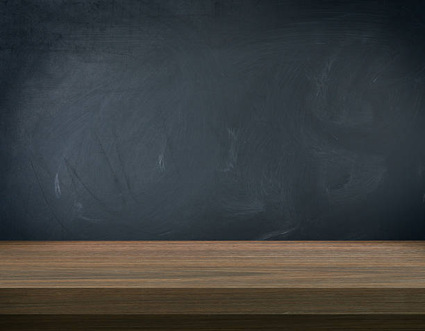 istock Surface of wooden table with black background 473294036