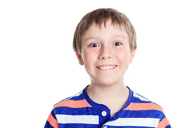 istock cheerful smiling little boy Isolated on white background 473294658