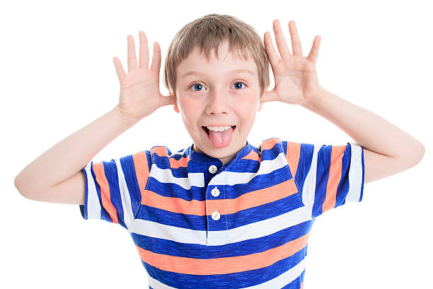 istock Little boy wincing on white background 473294660