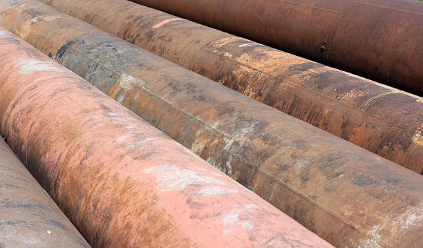 istock Group of old rusty metal pipes 473295442