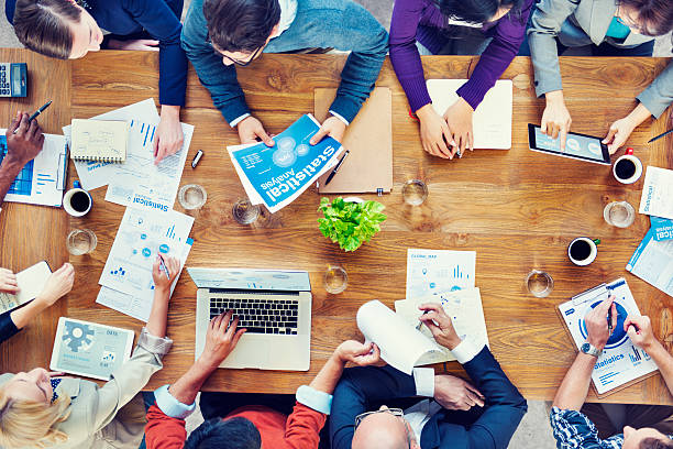 istock A group of business people working around a table 473296536