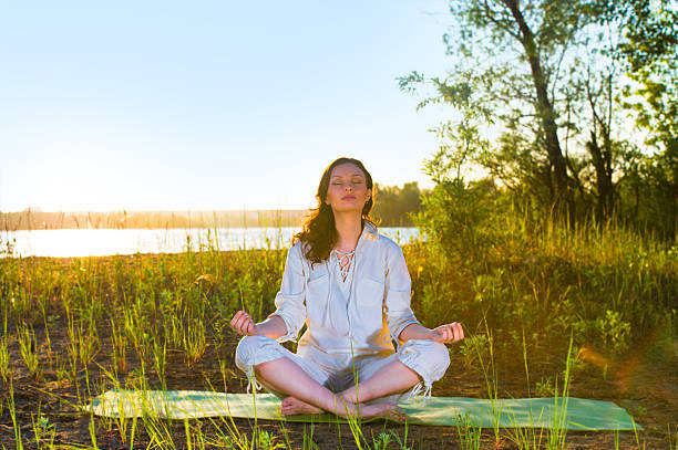 istock Beautiful young woman doing yoga 473296676