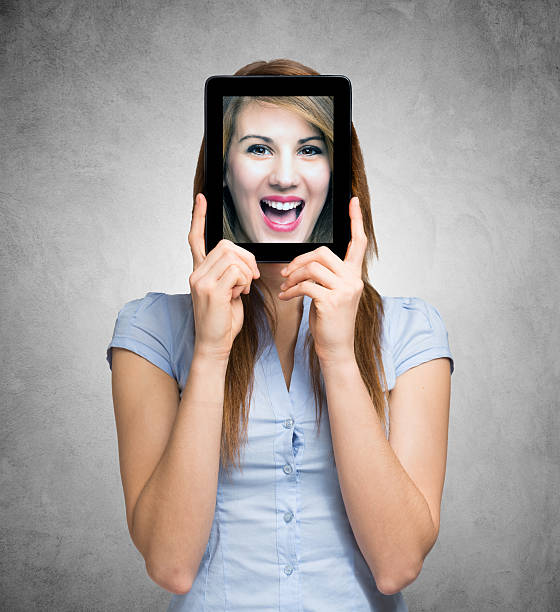 istock Woman holding a digital tablet 473296802