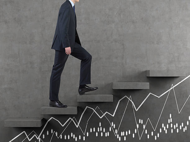 istock businessman walking on staircase 473297346