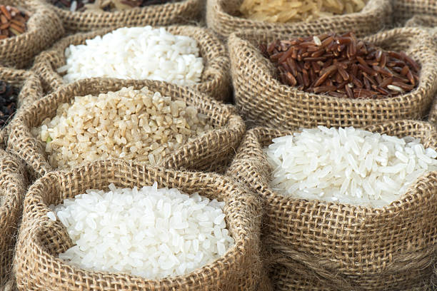 istock Group of organics rice in burlap bag 473299960