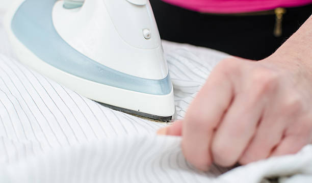 istock Ironing of a shirt 473300090