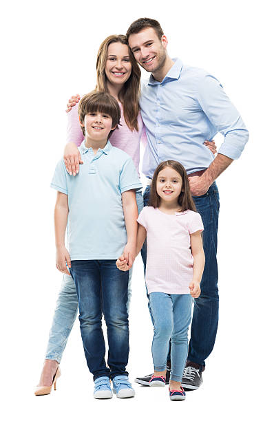 joven familia con dos hijos de pie juntos - family white family with two children cheerful fotografías e imágenes de stock