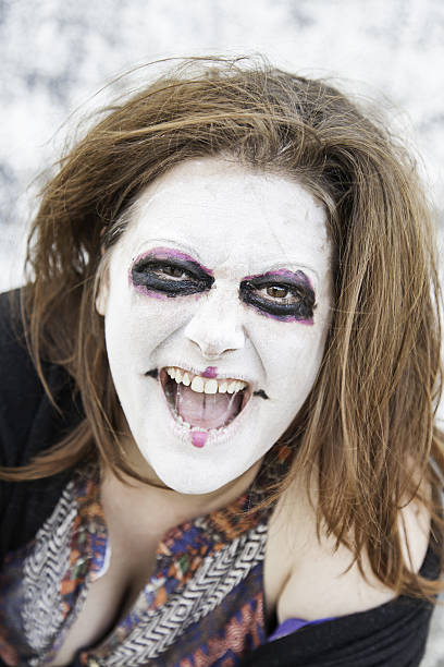 istock Woman smiles diabolical 473301330