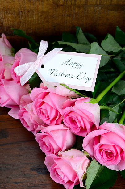 istock Vintage Pink Roses on Dark Wood Background. 473301420