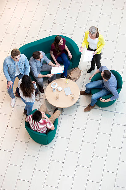 istock College Students and Teachers Meet in a Cafe 473301980