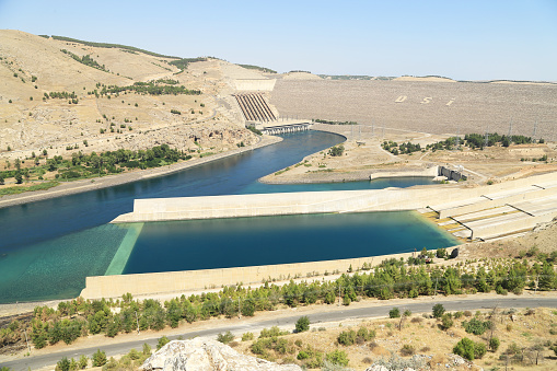 Khomarlu, Khoda Afarin County, East Azerbaijan province, Iran / Soltanly, Jabrayil District, Azerbaijan: Khudafarin Dam and the small / north Khoda Afarin / Khudafarin Bridge, across the Aras River in the Caucasus, the border between Iran and Azerbaijan. One of the two bridges, connecting the Iranian province of East Azerbaijan in the south and the Jebrayil Rayon of Azerbaijan in the north. The small bridge has eleven arches and was built in the 11th-12th centuries, only three arches remain intact, probably dates from the  Safavid era (1501–1736).