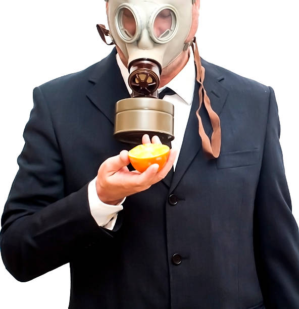 istock Businessman with gas mask 473302966
