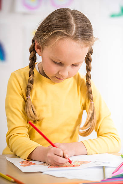 istock Girl drawing 473303026