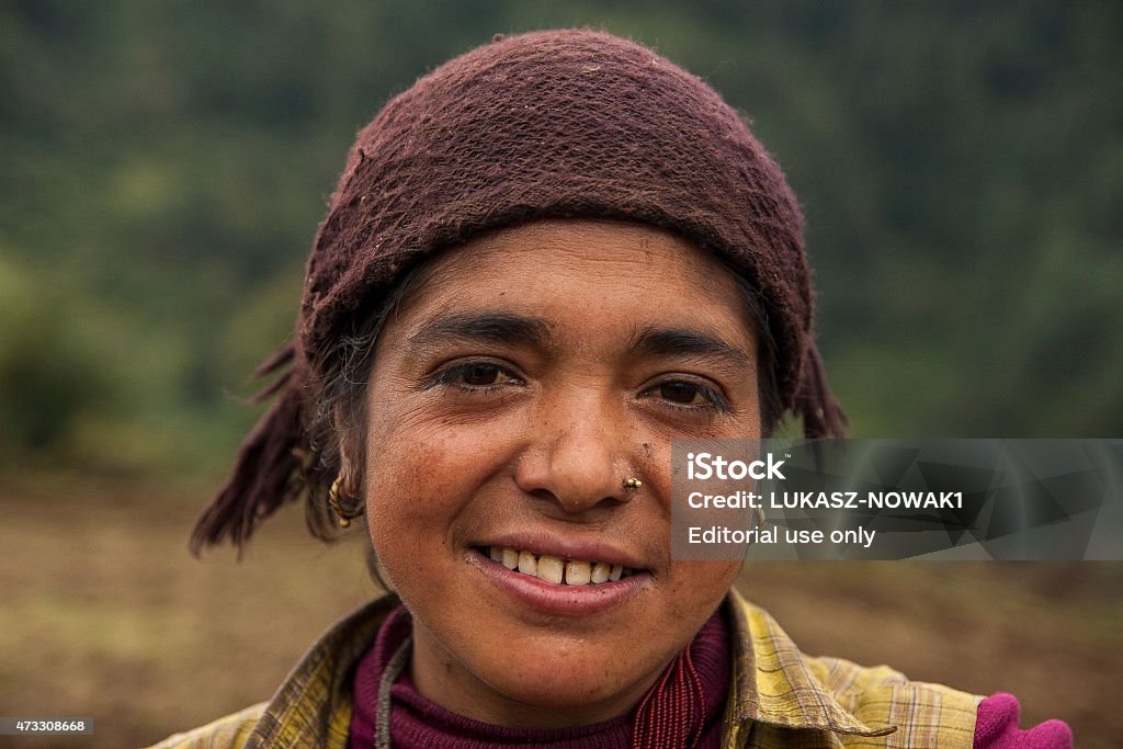portrait Junbesi, Nepal - October 7, 2013: Nepalese in the ethnographic sense did not exist in the past as a tribe. The ethnogenesis of modern Nepalese biggest role played three groups of people: Newar people, Khasa and Gurkhas. The name "Nepal" and "Nepalese" comes from the dominant culture Newars ethnic group, living in the Kathmandu Valley for centuries, speakers of the language Himalayan newari. Nepalese live actually in the natural economy. About 75% of the natural flow of income from agriculture (17% of the land is arable land). 2015 Stock Photo