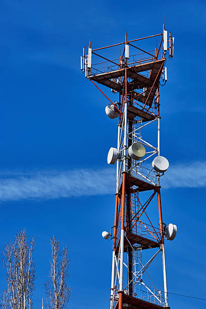 Cell tower Cell tower on a background of blue sky poplar tree audio stock pictures, royalty-free photos & images