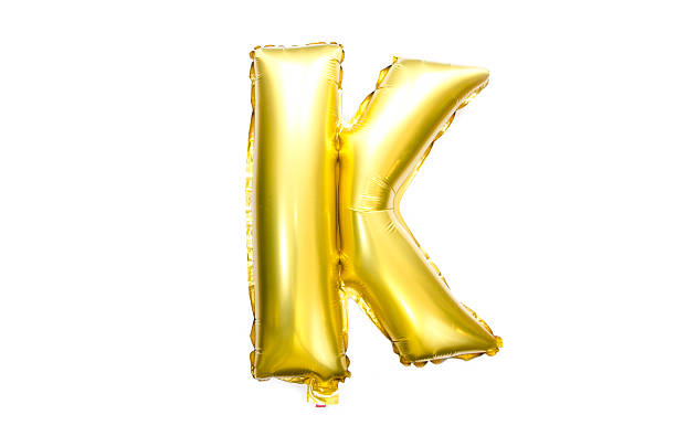 istock Golden Alphabet Foil Balloon Letter K 473312174