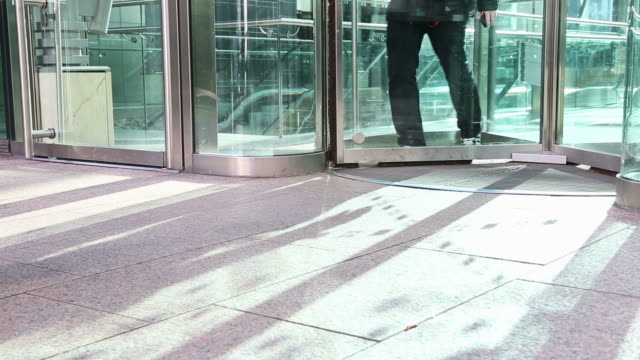 HD: People Walking Through Glass Door