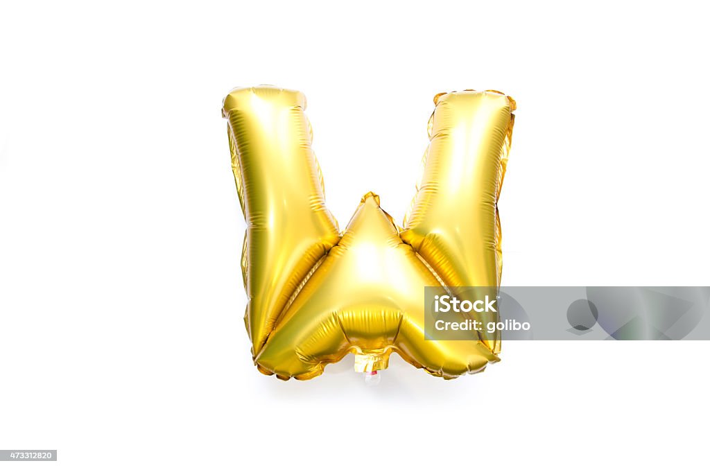 Golden Alphabet Foil Balloon Letter W Golden Alphabet Foil Balloon Capital Letter W isolated on white photographed in a studio. 2015 Stock Photo