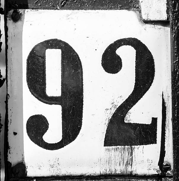 istock Old scratched metal plate with the number ninety-two 473313548