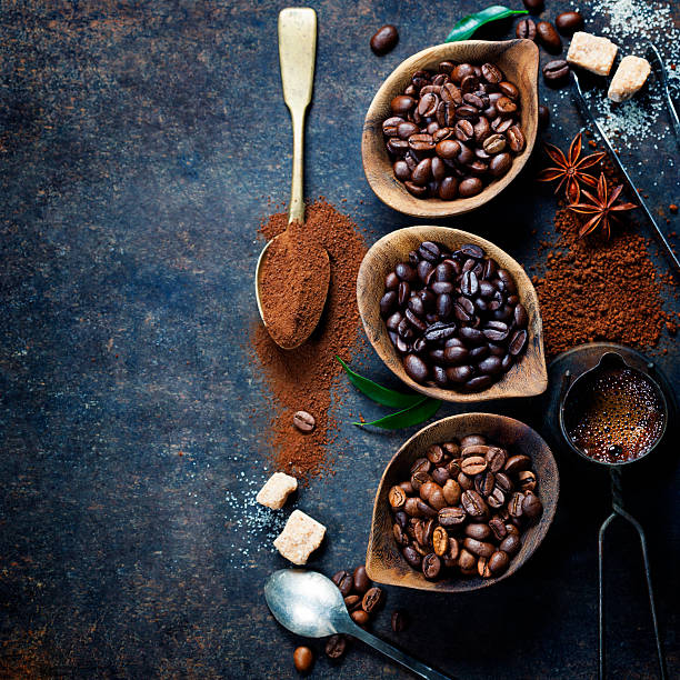 istock Containers of different coffee beans with spoon of powder 473317640