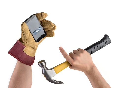 hand construction worker with hammer and smartphone on white isolated background, purchase in the online store, button to buy