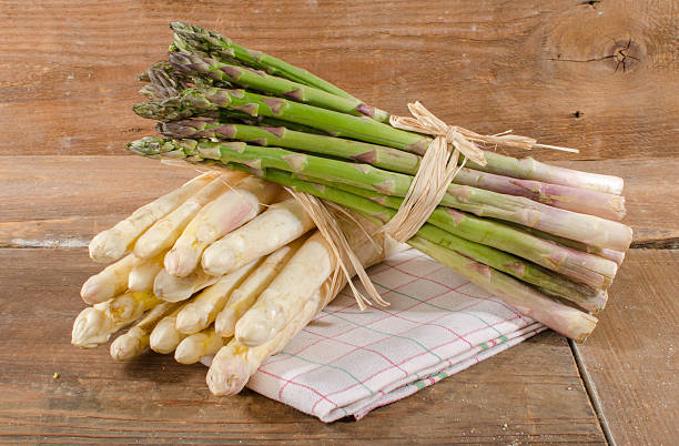 istock Bunch of fresh white and green asparagus 473319440