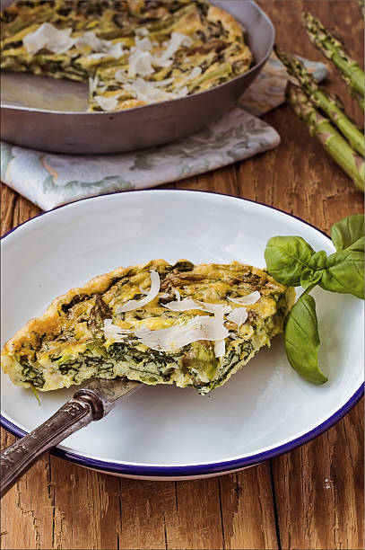 Spinach e green asparagus frittata. Italian cuisine stock photo
