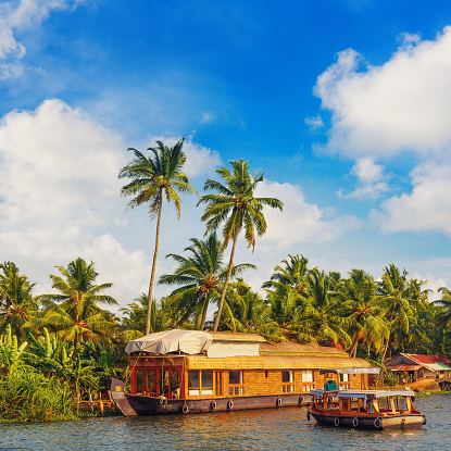 Famous Mobor beach in Goa with a traditional fishing boat.