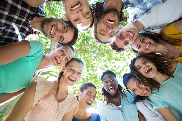 istock Happy friends in the park 473320896