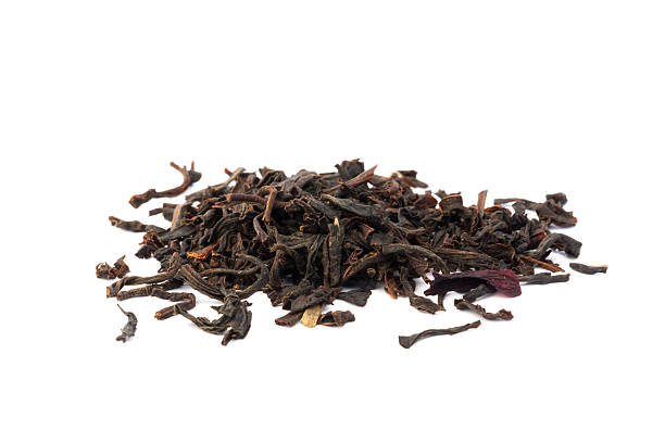 istock dry black tea leaves isolated on a white background 473323992