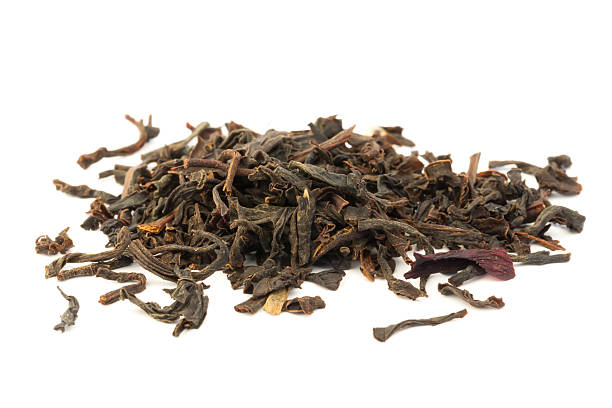 istock dry black tea leaves isolated on a white background 473323994