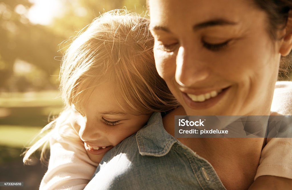 Bonding with her precious daughter Shot of a loving mother and daughter at the park 2015 Stock Photo