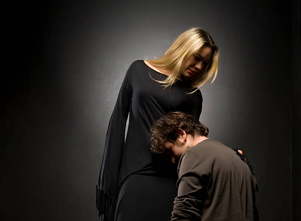 istock Glamourous blonde lady with her slave 473324558