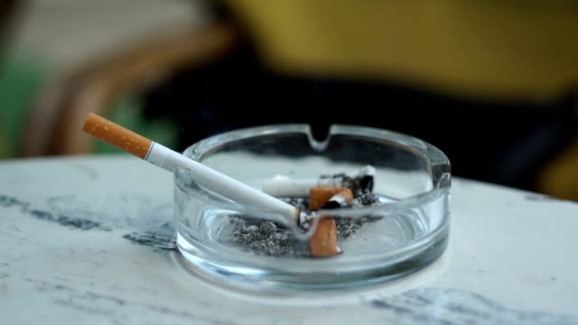 Smoking Cigarette in Ash Tray