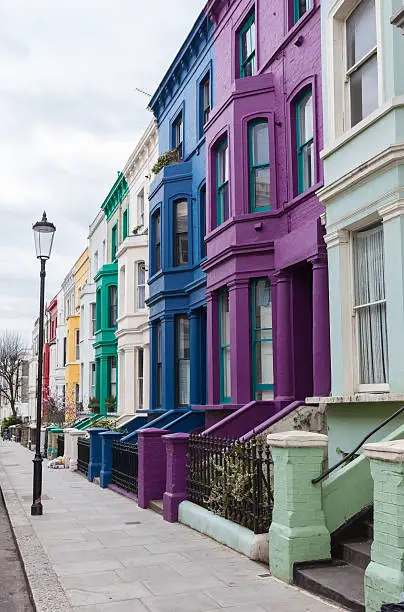 Coloured properties on Lancaster Road in Notting Hill neighbourhood, north west London.