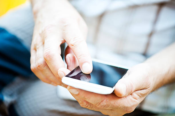istock Hand Holding a Smart Phone 473330594