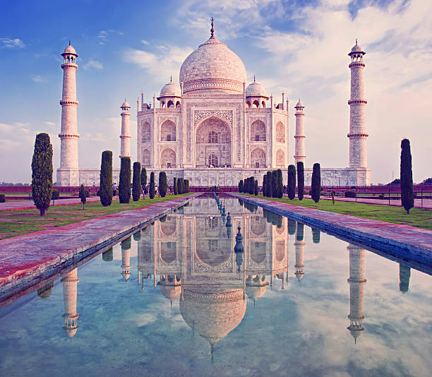 istock Taj Mahal at sunrise featuring water and sky 473330654