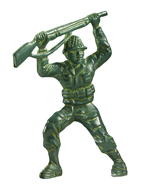 istock Green Soldier Holding Gun Above His Head 473335192