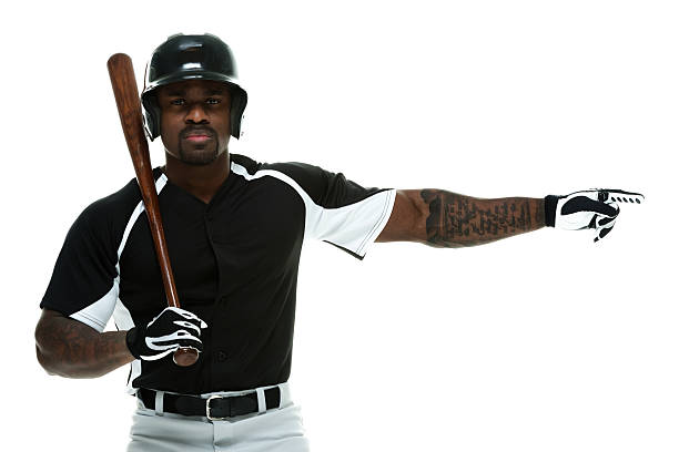 istock Baseball player holding bat and pointing away 473335924