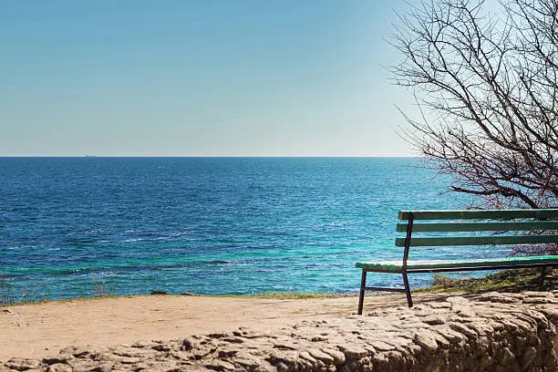 The Black Sea. Bench on the coast sea. Sunny day.