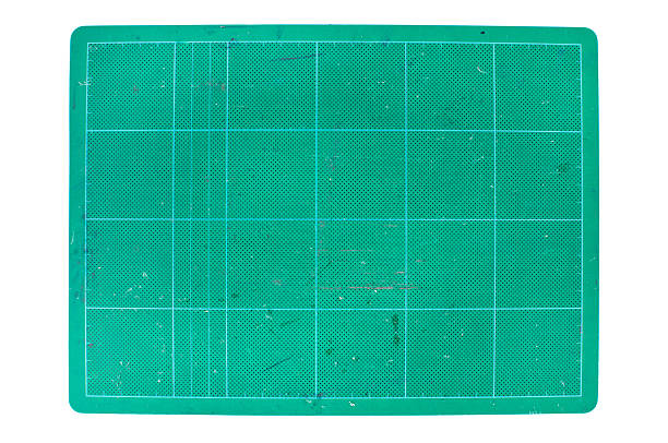 istock used green cutting mat on white background 473340050