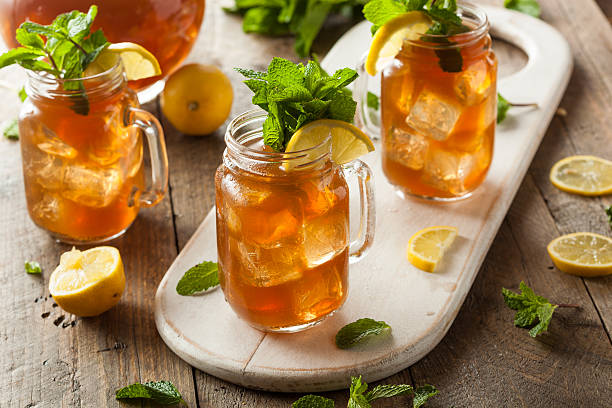 Homemade iced tea and lemonade Homemade Iced Tea and Lemonade with Mint lemon soda photos stock pictures, royalty-free photos & images