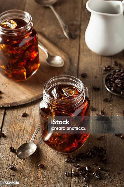 Cold Brew Coffee In Mason Jars On A Wooden Table Stock Photo - Download Image Now - Cold Brew Coffee, 2015, Arabica Coffee - Drink