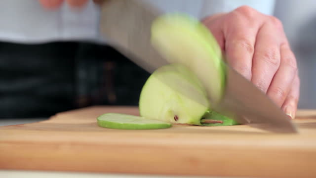 Cutting apple on slices