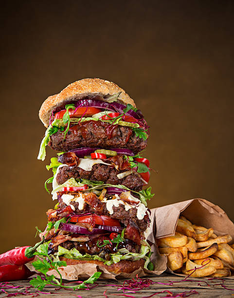 istock delicious big hamburger on wood 473360406