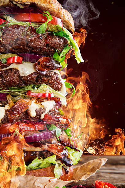 istock delicious big hamburger on wood 473360432